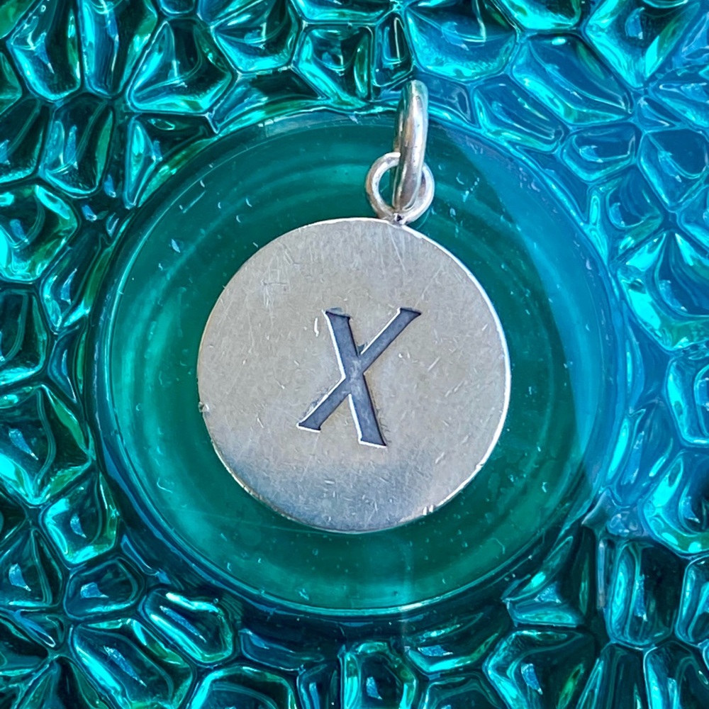 Tiffany & Co Silver Round X pendant by/charm